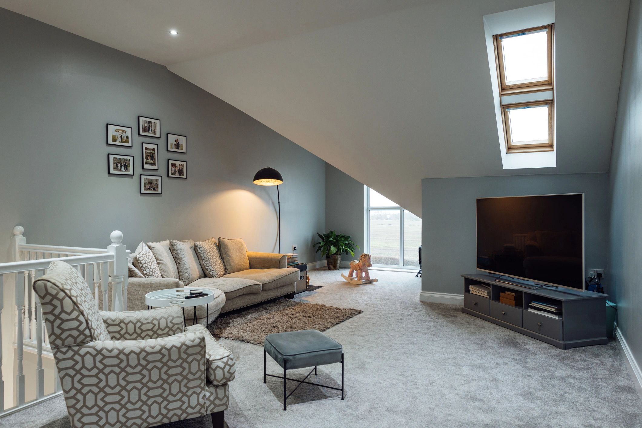 Modern UK living room with sofa and natural light